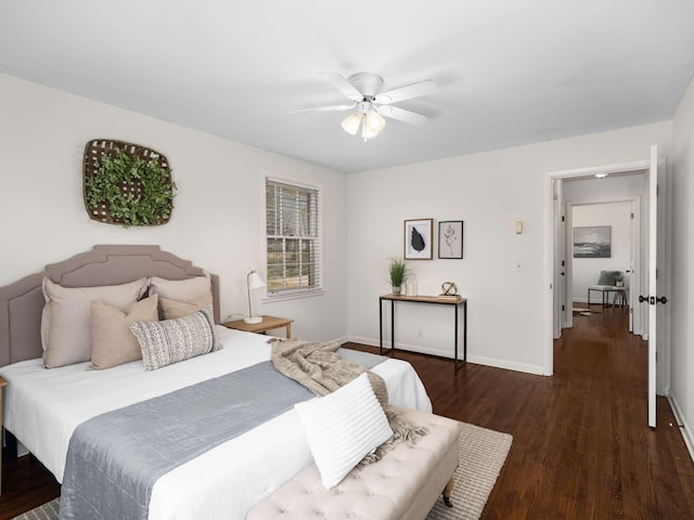 bedroom featuring baseboards, wood finished floors, and a ceiling fan