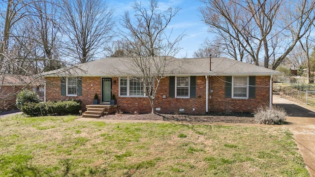 single story home featuring brick siding, a front lawn, and fence