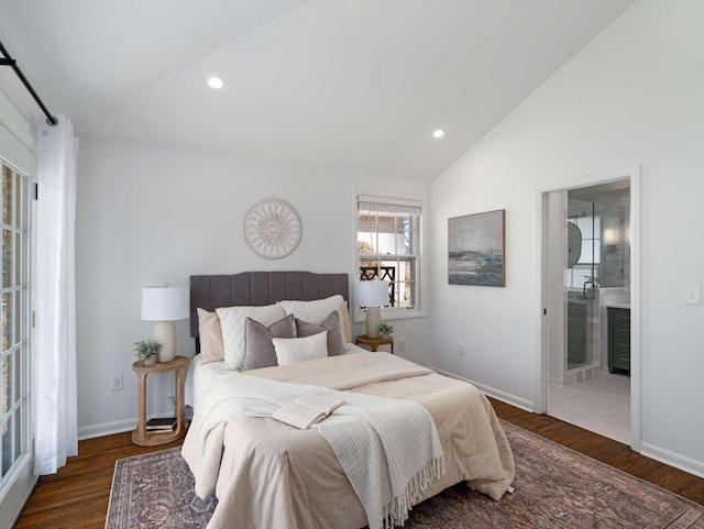 bedroom featuring wood finished floors, baseboards, lofted ceiling, recessed lighting, and connected bathroom