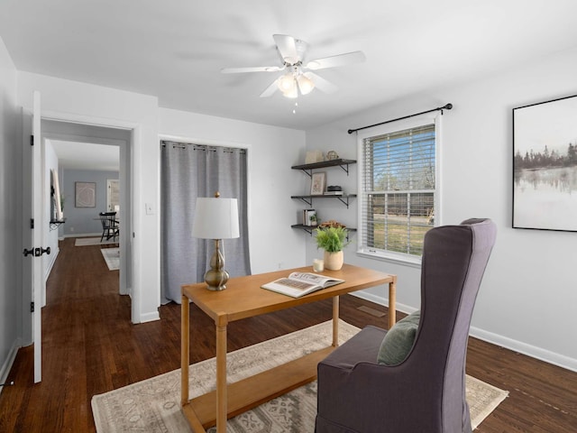 office area with ceiling fan, baseboards, and wood finished floors