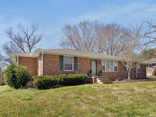 ranch-style home with brick siding and a front lawn