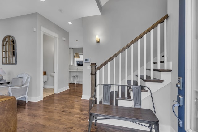 foyer entrance with dark wood-type flooring