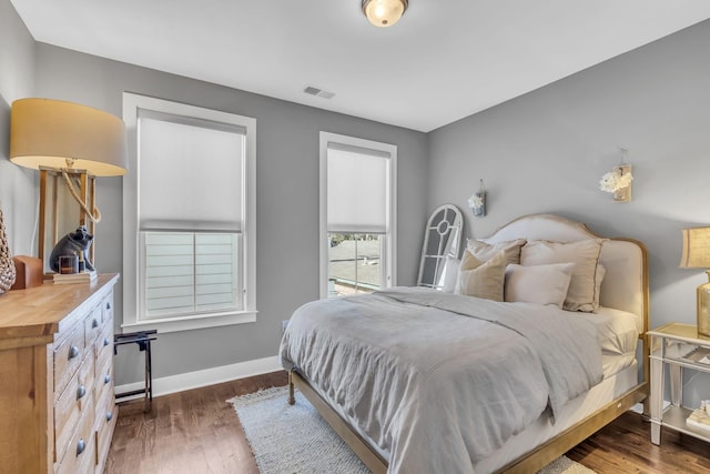 bedroom featuring dark hardwood / wood-style flooring