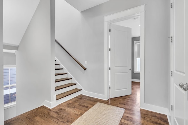 staircase featuring hardwood / wood-style floors