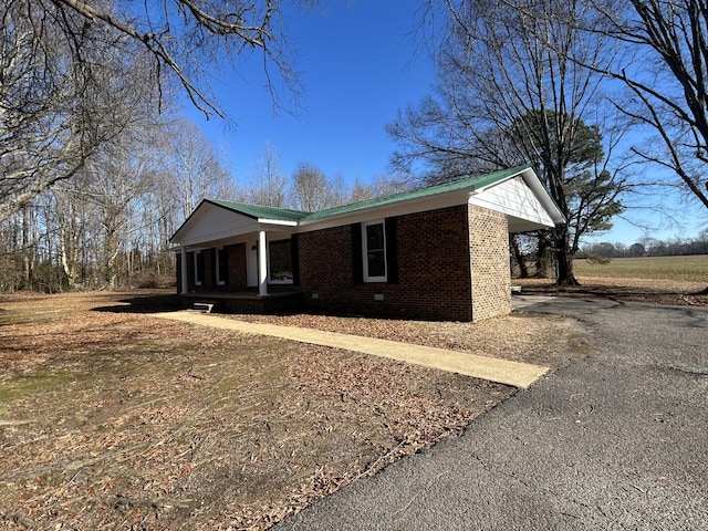 view of front of home featuring a carport