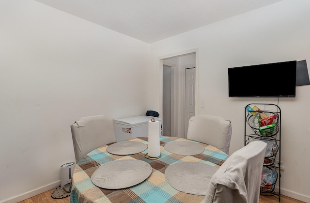 dining area with light hardwood / wood-style flooring