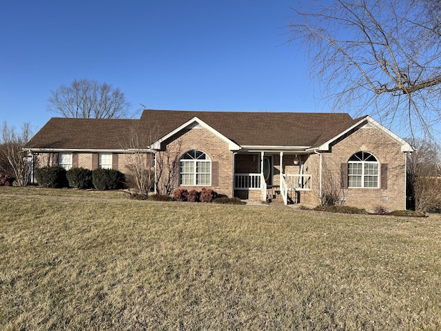 ranch-style house featuring a front yard