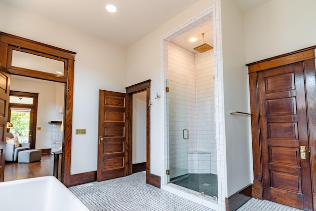 bathroom with separate shower and tub