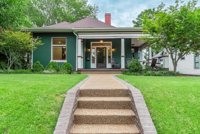 view of front of home featuring a porch and a front yard