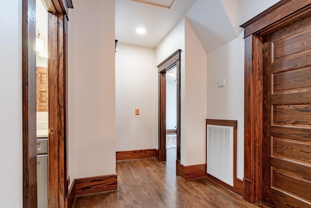 hall with dark hardwood / wood-style floors