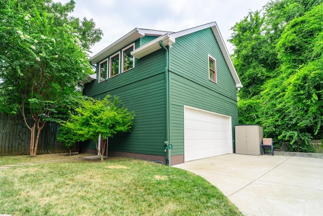 view of property exterior featuring a garage and a yard