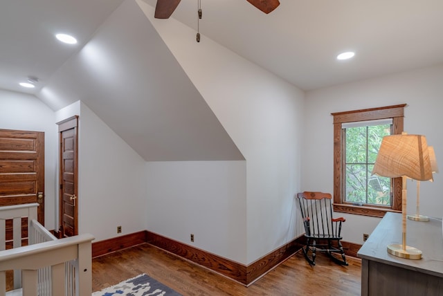 bedroom featuring ceiling fan, dark hardwood / wood-style flooring, and vaulted ceiling