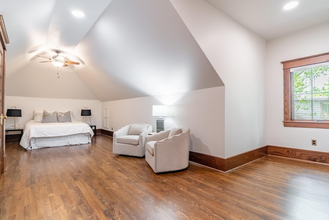 bedroom featuring dark wood-type flooring, ceiling fan, and vaulted ceiling