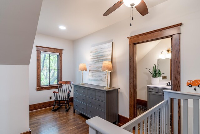 interior space with vaulted ceiling, dark hardwood / wood-style floors, and ceiling fan