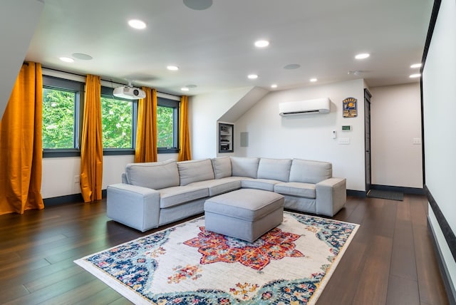 living room featuring dark hardwood / wood-style flooring and a wall unit AC