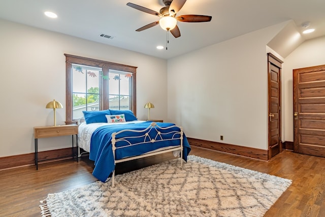 bedroom with hardwood / wood-style flooring and ceiling fan