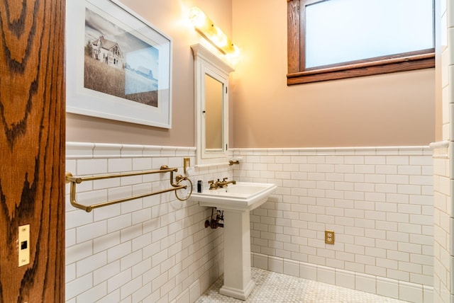 bathroom featuring tile patterned flooring and tile walls