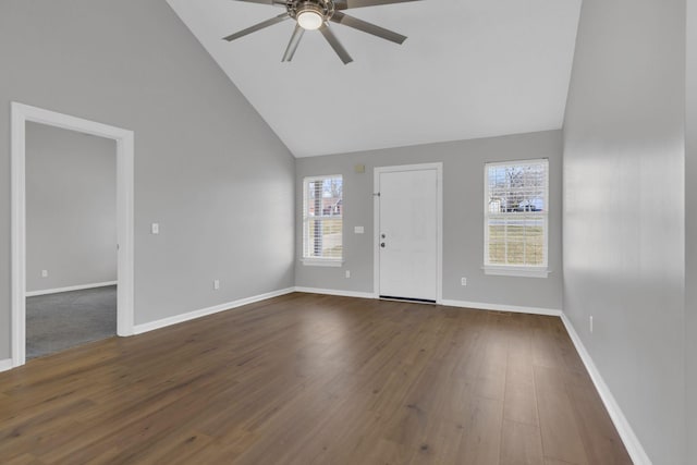 interior space featuring dark hardwood / wood-style flooring, high vaulted ceiling, and ceiling fan