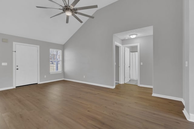 unfurnished living room with hardwood / wood-style floors, vaulted ceiling, and ceiling fan