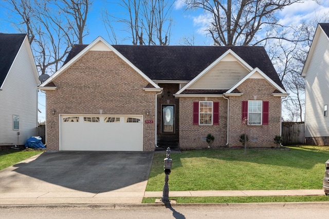 view of front of property featuring a garage and a front yard