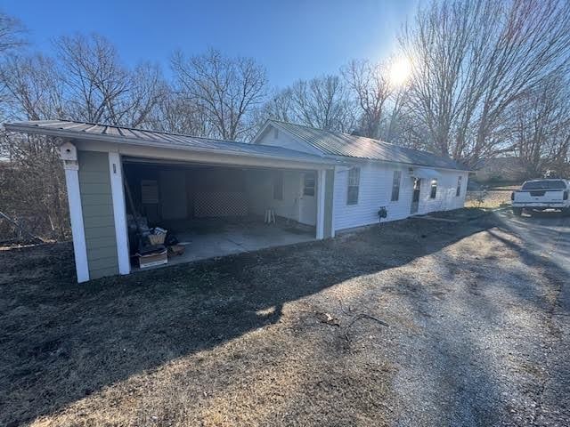 view of side of home with a garage