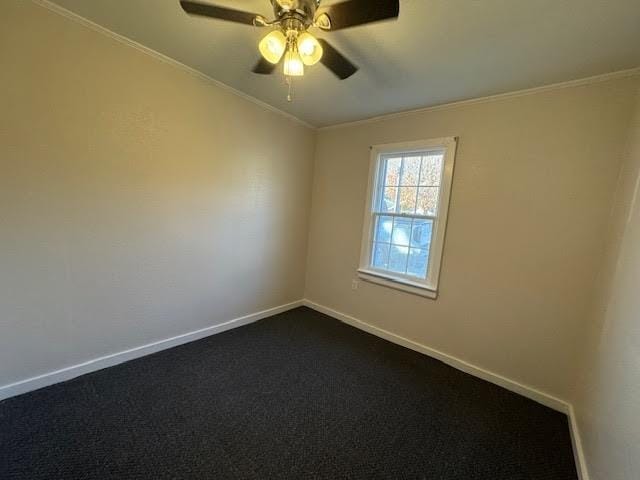 carpeted empty room featuring ceiling fan and ornamental molding