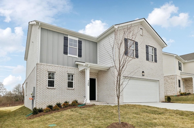 view of front of home with a garage and a front yard