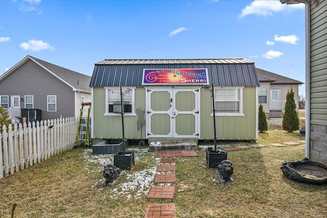 view of outbuilding with a lawn