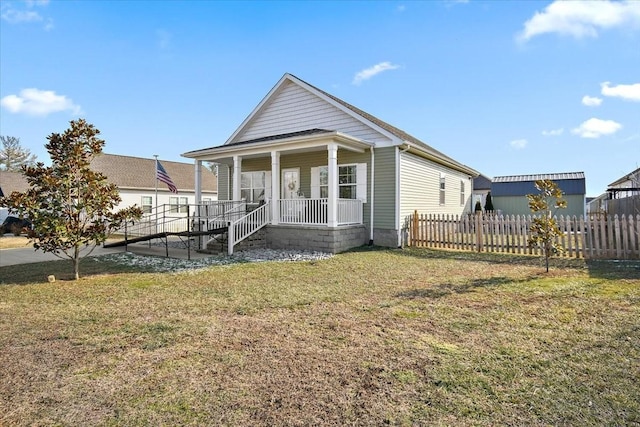 view of front of property with covered porch and a front lawn