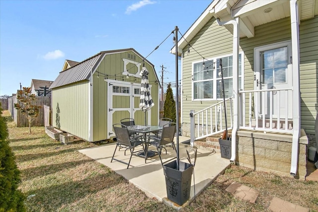 view of patio / terrace featuring a shed