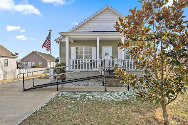 back of house featuring covered porch