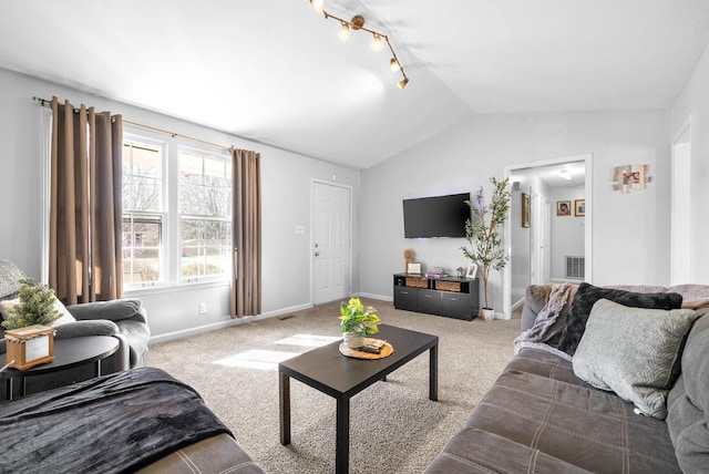 carpeted living room featuring rail lighting and lofted ceiling