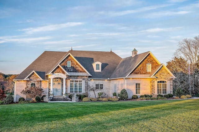 craftsman house with a front lawn