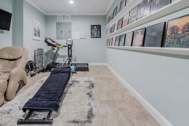 exercise room with ornamental molding and electric panel