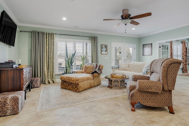 living room with ornamental molding, ceiling fan, and french doors