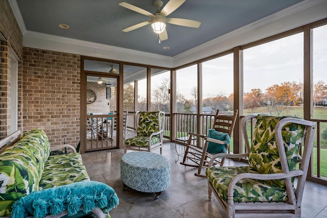 sunroom / solarium featuring ceiling fan