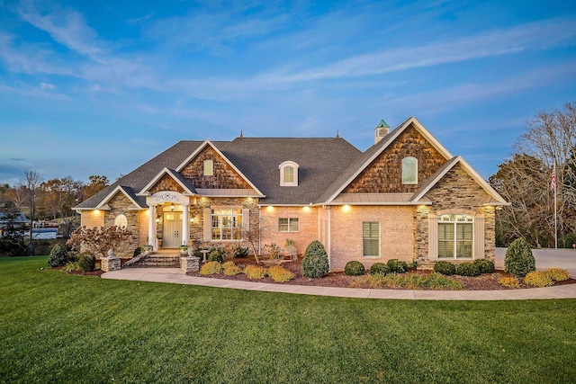 craftsman inspired home with a lawn