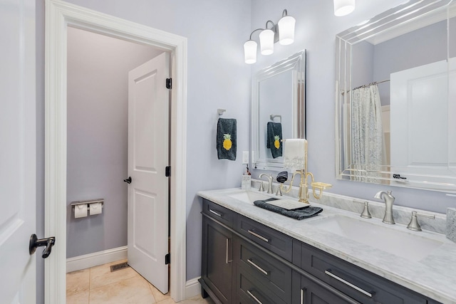 bathroom with vanity and tile patterned floors