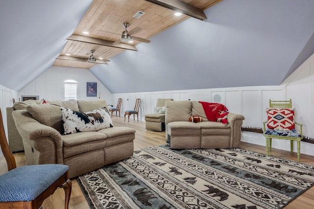 living room with wood ceiling, ceiling fan, light hardwood / wood-style floors, and lofted ceiling with beams