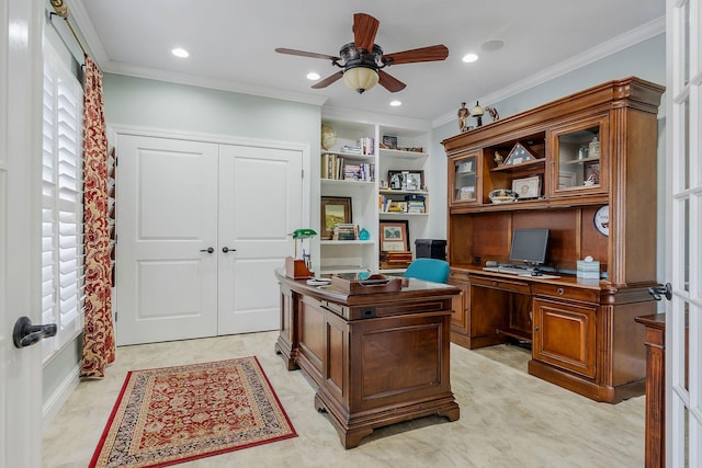 office area featuring crown molding, ceiling fan, and built in features