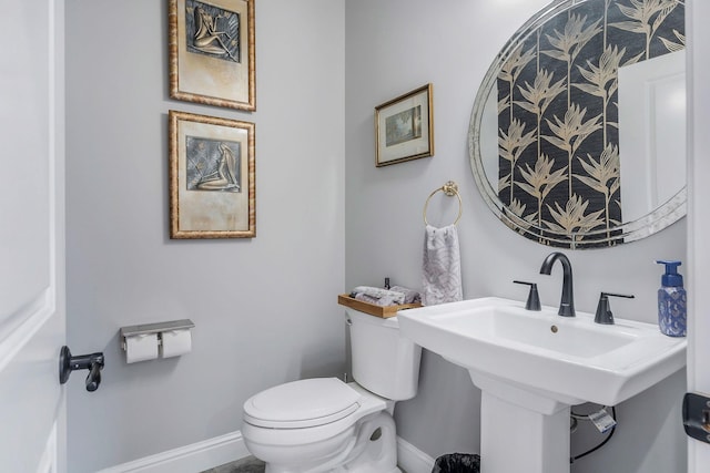 bathroom with toilet and sink