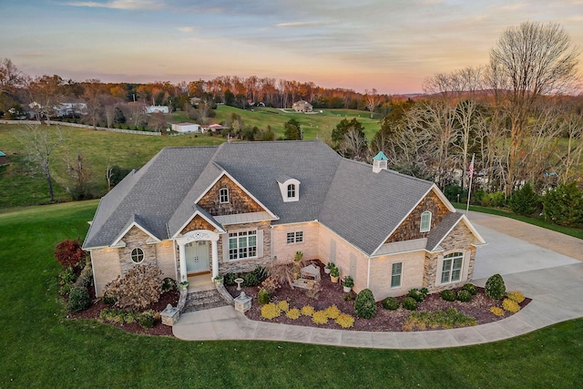 craftsman-style house with a yard