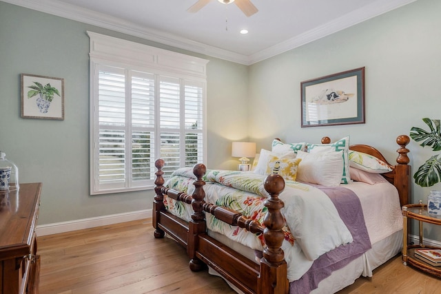 bedroom featuring crown molding, light wood-type flooring, and ceiling fan