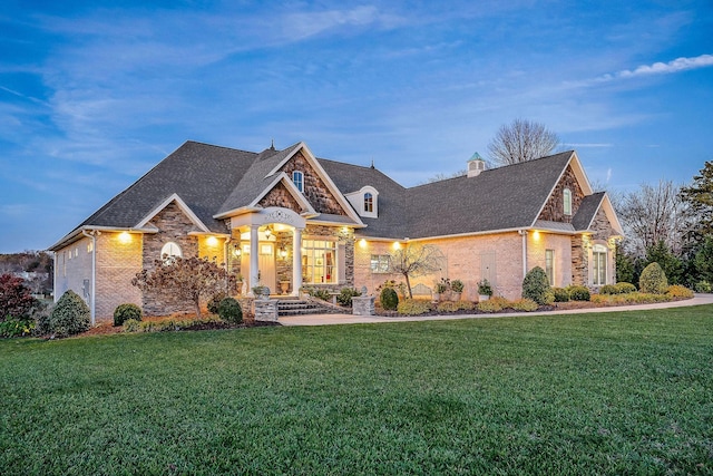 view of front of property with a lawn