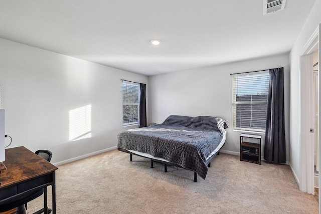 bedroom with light colored carpet