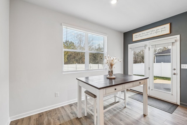 unfurnished dining area featuring light hardwood / wood-style flooring