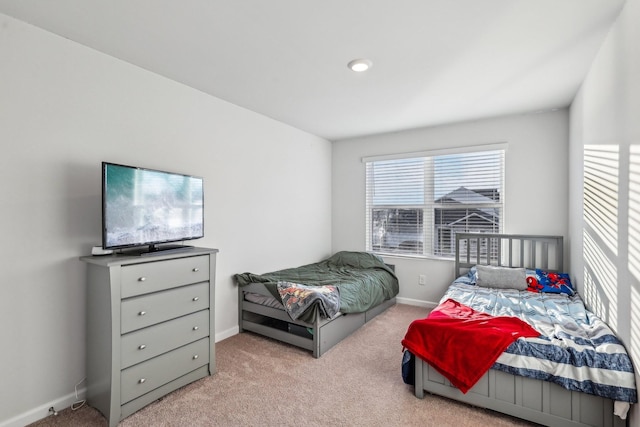 bedroom featuring light carpet