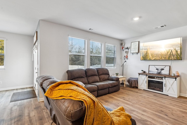 living room with light hardwood / wood-style floors