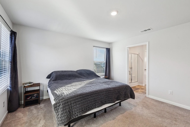 carpeted bedroom with ensuite bathroom