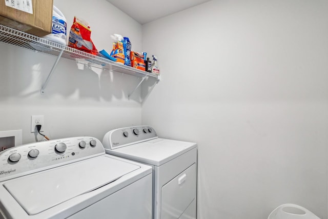 laundry room with separate washer and dryer